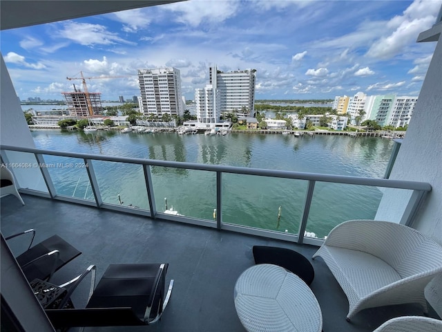 balcony featuring a water view