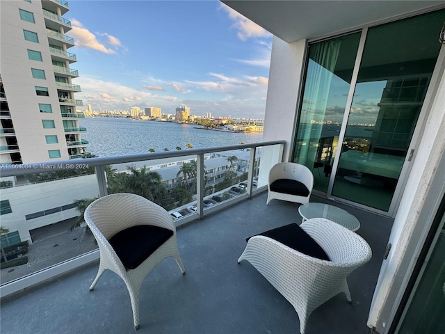 balcony featuring a water view