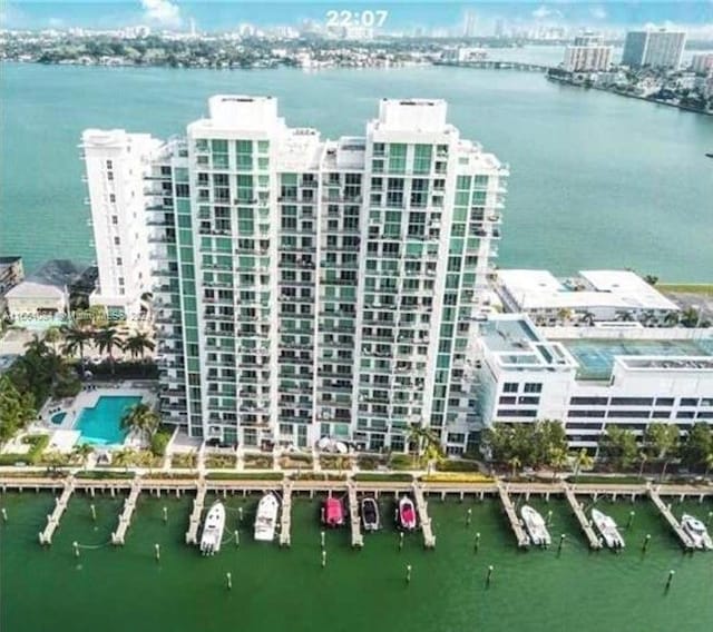 birds eye view of property with a water view