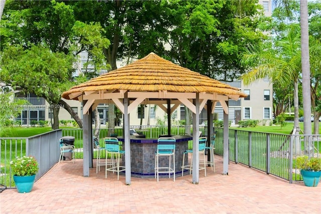 view of property's community with a gazebo, a yard, and a patio area