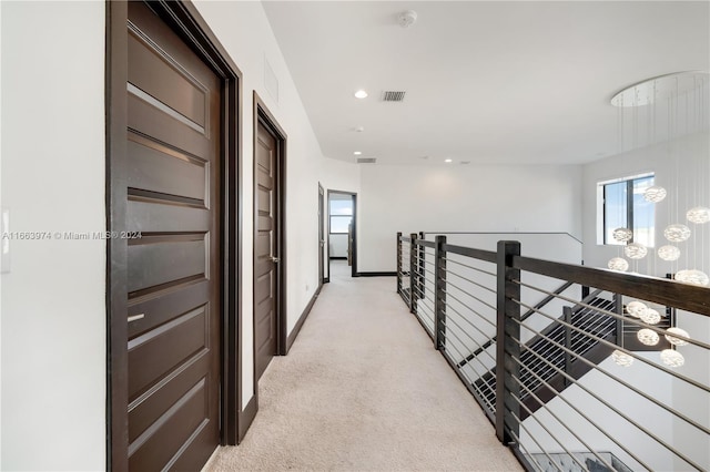 hallway with light carpet