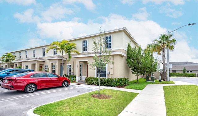 view of property featuring a front yard