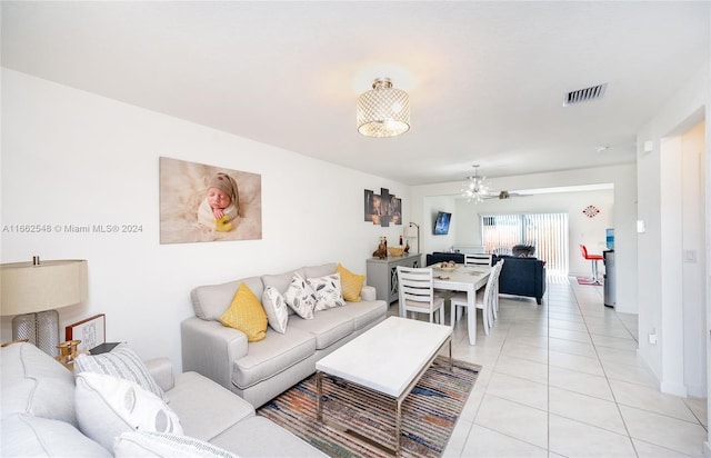 tiled living room with ceiling fan