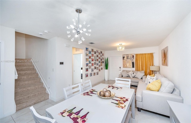 dining space with a notable chandelier and light tile patterned floors