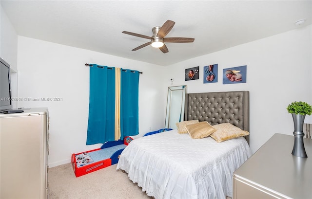 bedroom with ceiling fan and carpet