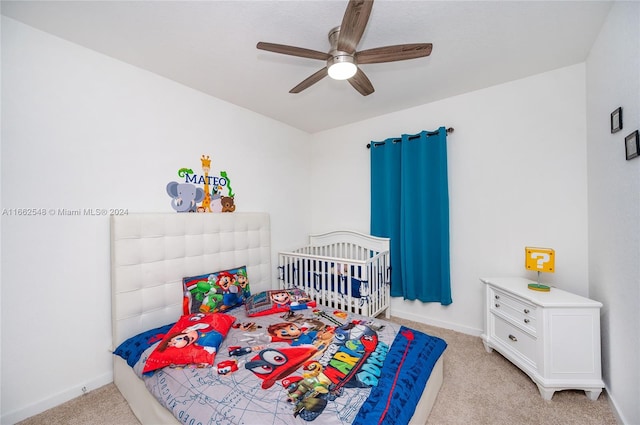 bedroom with ceiling fan and light colored carpet