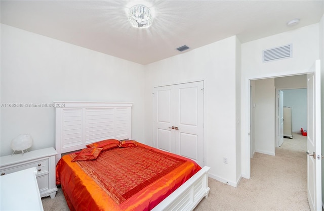 carpeted bedroom with a closet