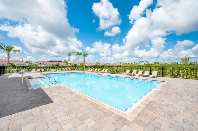 view of swimming pool with a patio