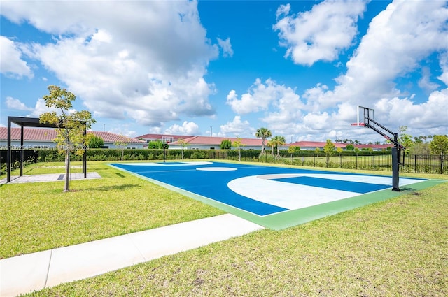 surrounding community with basketball court and a yard