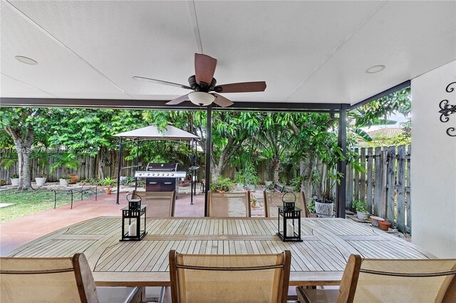 view of patio / terrace featuring a grill and ceiling fan