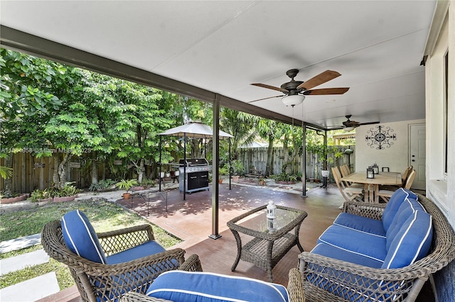 view of patio / terrace featuring ceiling fan, a fenced backyard, a grill, outdoor lounge area, and outdoor dining space