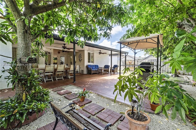 view of patio / terrace with ceiling fan and outdoor dining area