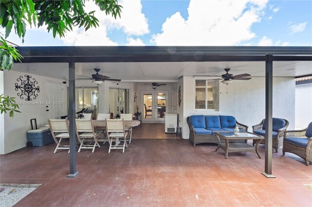 view of patio / terrace with french doors and an outdoor living space