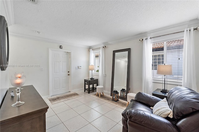 living room featuring a textured ceiling, baseboards, crown molding, and light tile patterned flooring