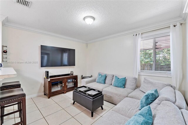 living room with a textured ceiling, light tile patterned floors, and crown molding