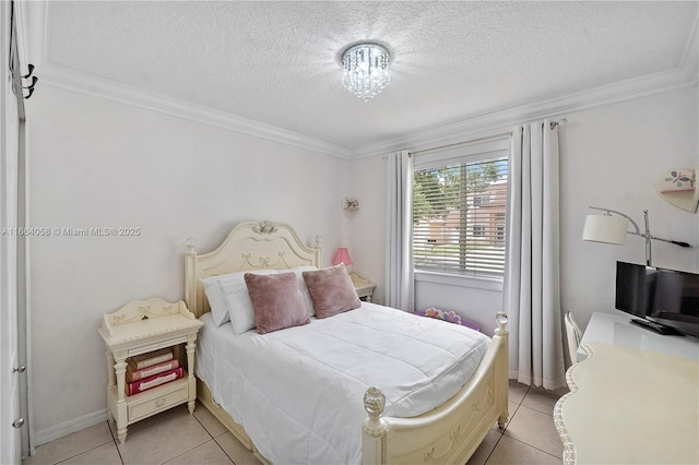 bedroom with a textured ceiling, light tile patterned floors, and crown molding