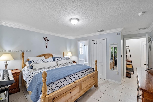 bedroom with light tile patterned floors, visible vents, a textured ceiling, and ornamental molding