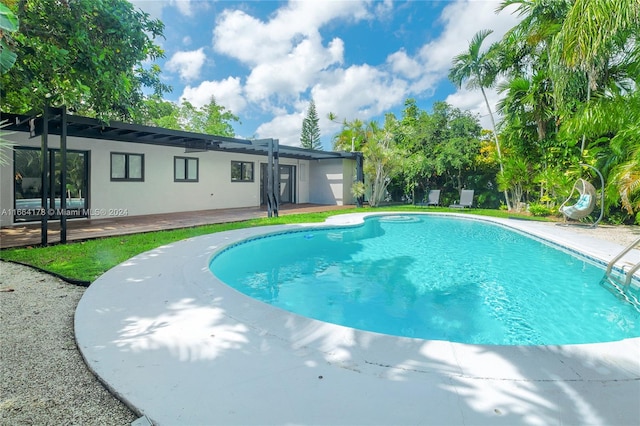 view of pool featuring a patio and french doors