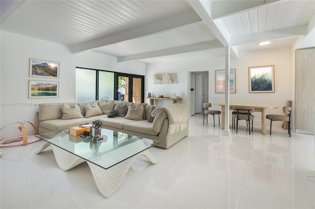 living room featuring light tile patterned flooring and beam ceiling