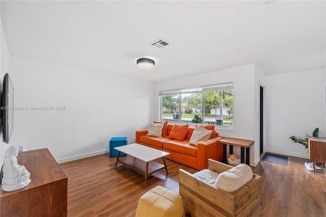 living room featuring dark hardwood / wood-style flooring