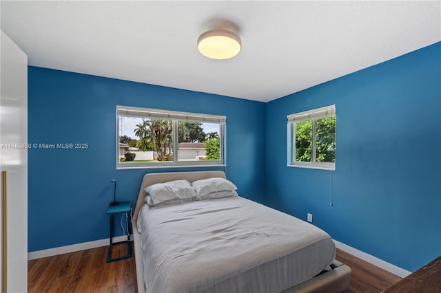 bedroom featuring dark wood-type flooring