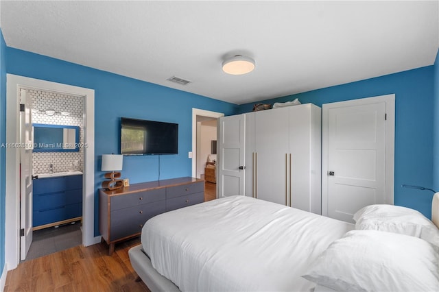 bedroom featuring dark wood-type flooring