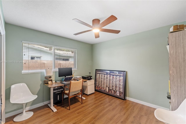 office area with ceiling fan and light hardwood / wood-style flooring