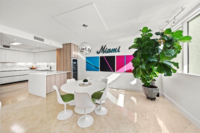 dining area featuring marble finish floor, visible vents, and baseboards