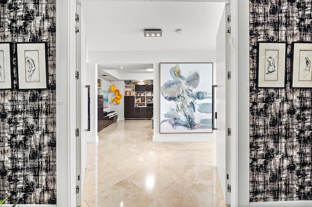 hallway with a tray ceiling