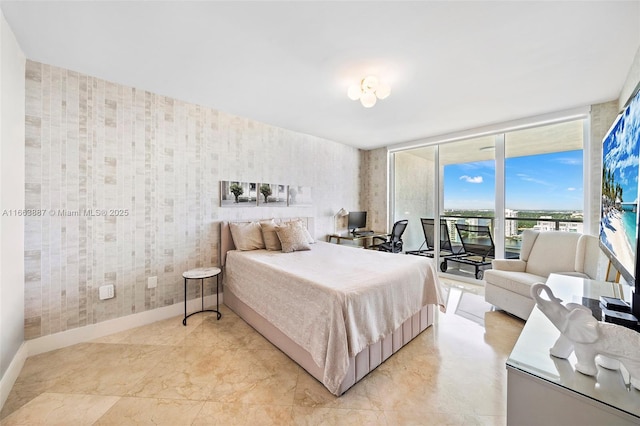 bedroom with baseboards, access to outside, and wallpapered walls