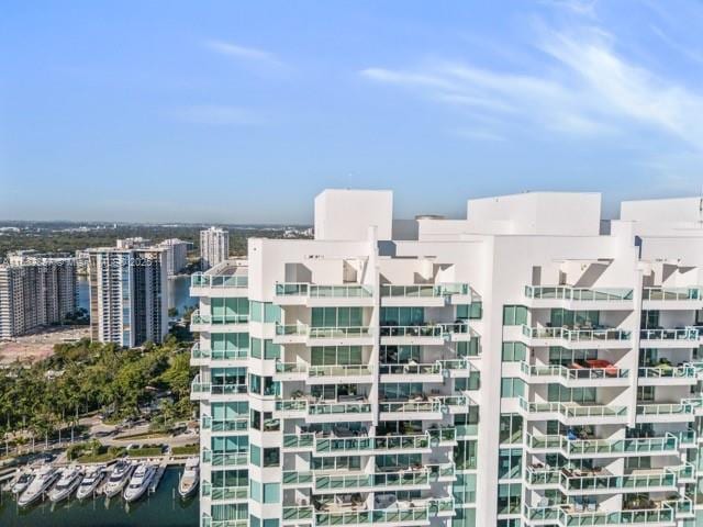 view of property featuring a view of city and a water view