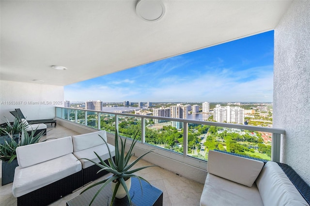 balcony with a view of city and an outdoor living space