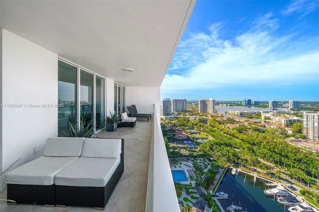 balcony with a view of city and a water view