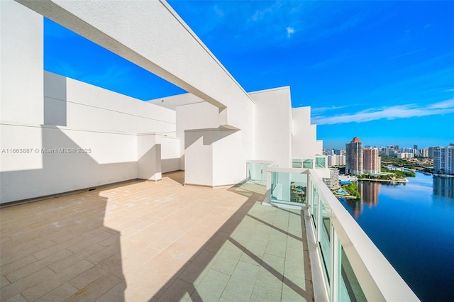 exterior space with a water view and a view of city