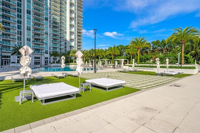 view of community featuring a patio area and a swimming pool