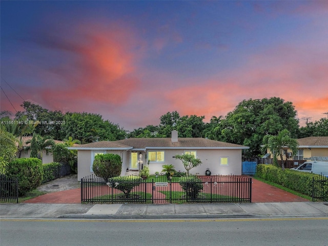 2380 SW 7th St, Miami, FL 33135 - ranch-style house with a fenced front yard, a chimney, and stucco siding