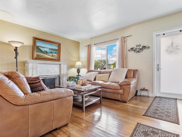 2380 SW 7th St, Miami, FL 33135 - living area with light wood-type flooring and a high end fireplace