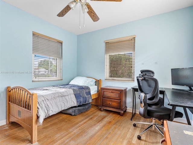 bedroom featuring ceiling fan and light wood-type flooring