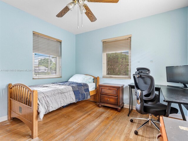 bedroom featuring light hardwood / wood-style floors and ceiling fan