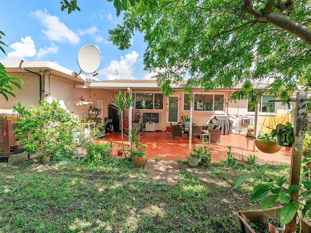 back of property with a patio area