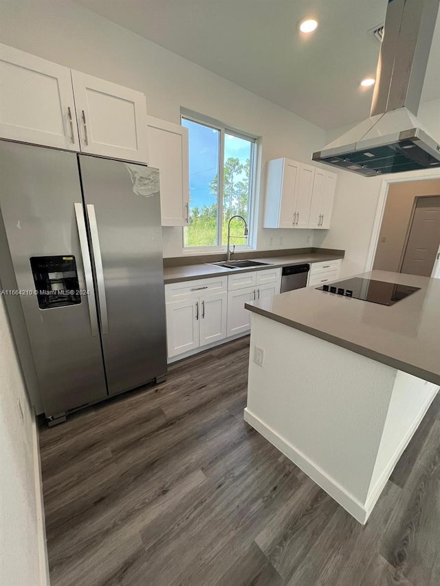 kitchen with white cabinets, sink, island exhaust hood, dark wood-type flooring, and appliances with stainless steel finishes