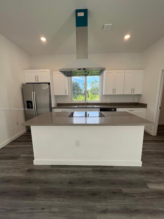 kitchen with white cabinets, island exhaust hood, and dark wood-type flooring