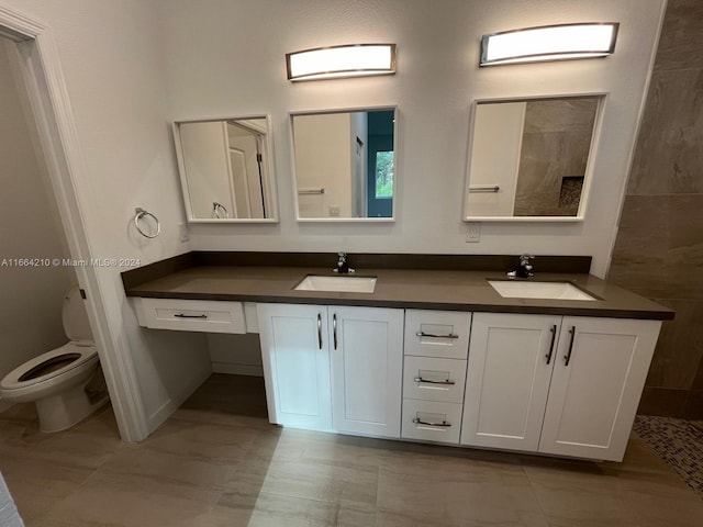 bathroom with vanity and toilet