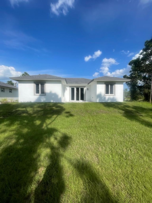 view of front of home with a front yard