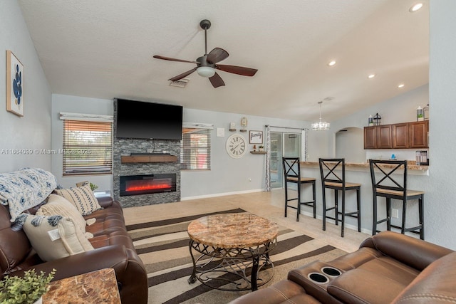 carpeted living room with a fireplace, ceiling fan with notable chandelier, vaulted ceiling, and a textured ceiling