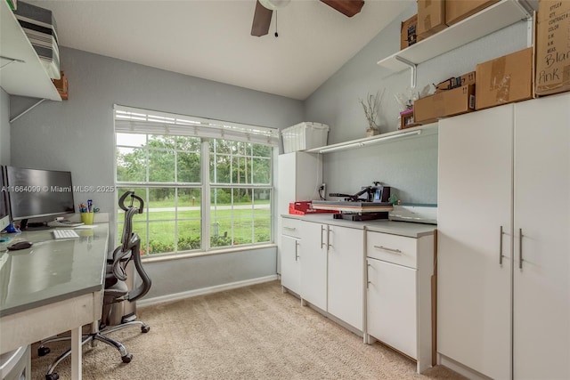 carpeted home office with ceiling fan