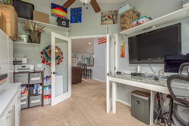 office space featuring light colored carpet, french doors, and ceiling fan