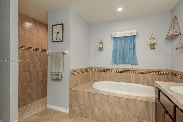 bathroom with vanity, shower with separate bathtub, and tile patterned flooring