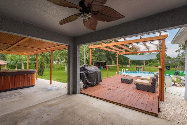 view of patio with a grill, a pool with hot tub, and a pergola