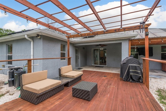 wooden terrace featuring area for grilling, a pergola, outdoor lounge area, and ceiling fan